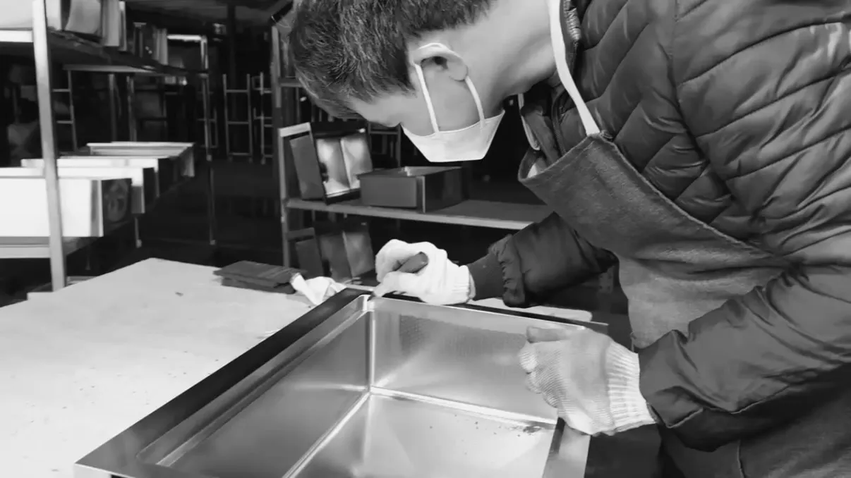 Factory storage area with organized blue containers and raw materials for sanitary product manufacturing