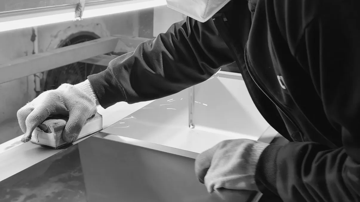 Industrial manufacturing equipment with a circular production line showing multiple stations for assembly of sanitary products